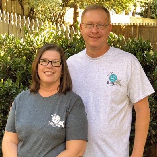 Paul and Tammy Mazurkiewicz in front of hedges